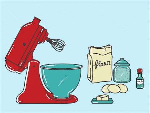 A stand mixer with flour eggs butter sugar and vanilla extract